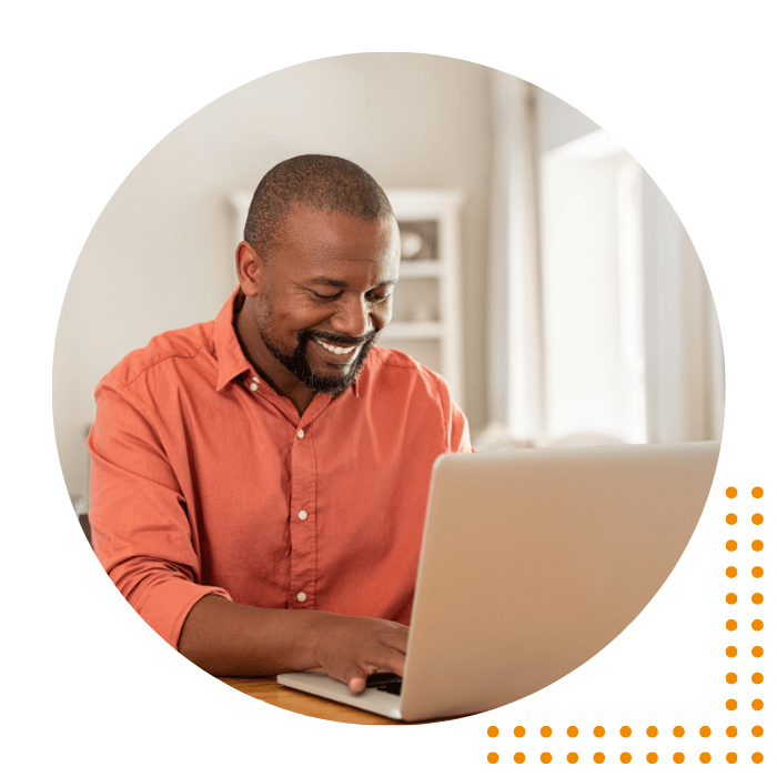 Man smiling at laptop